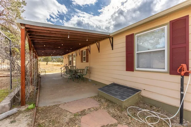 a view of porch with a bench in patio