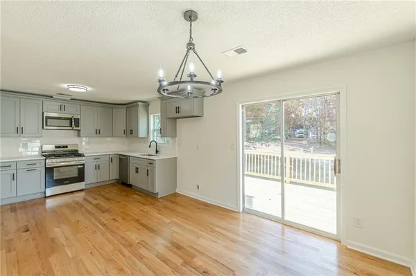 a view of a kitchen and a sink window
