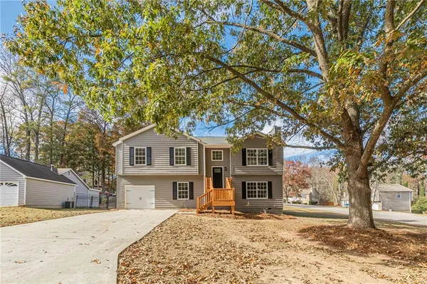 a front view of a house with a yard