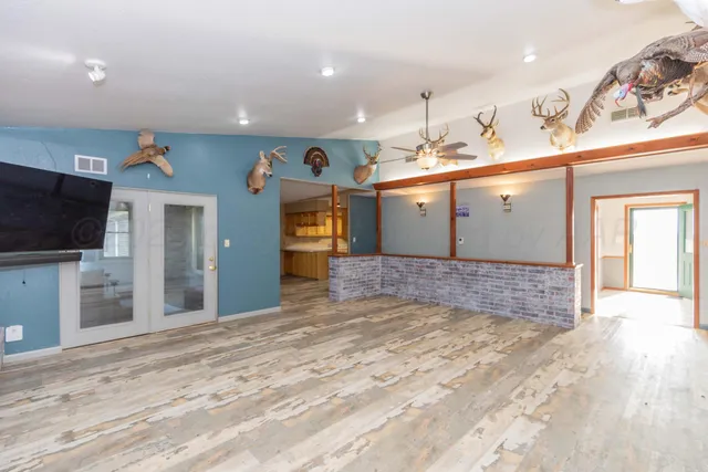 a view of a bathroom with a sink and mirror
