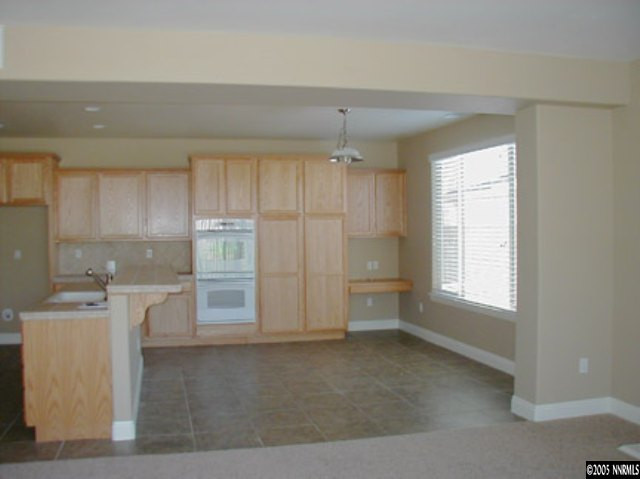645 Equine Court Reno, NV 89521 - Photo 6 of 9 a kitchen with a cabinets and window