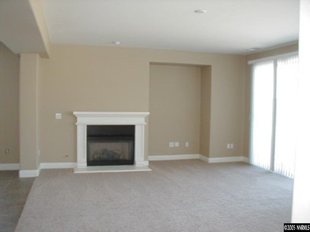 645 Equine Court Reno, NV 89521 - Photo 8 of 9 a view of empty room with a fireplace