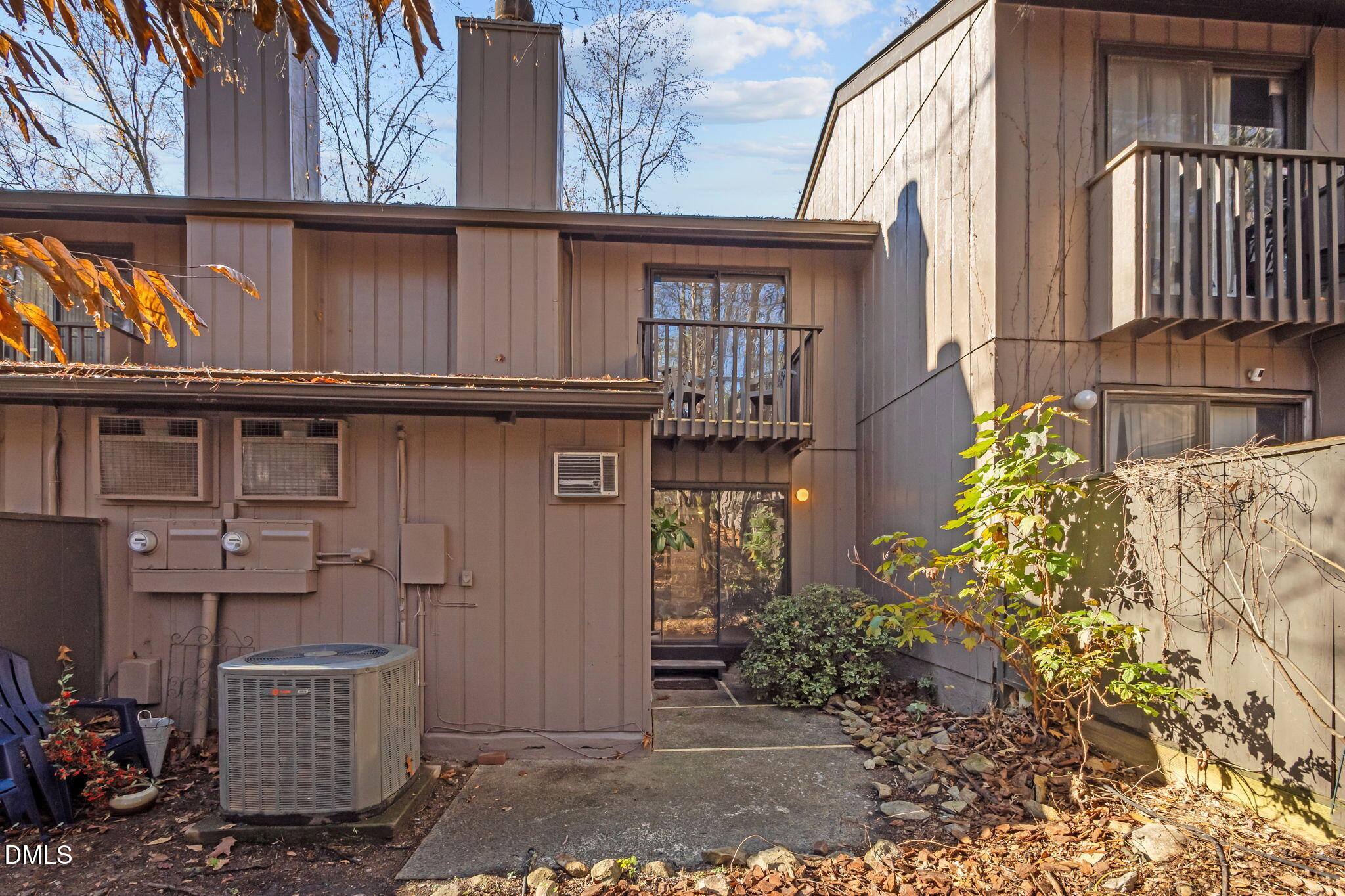 3080 Colony Road, Unit 3080C Durham, NC 27705 - Photo 36 of 57 a view of a house with a door and wooden bench