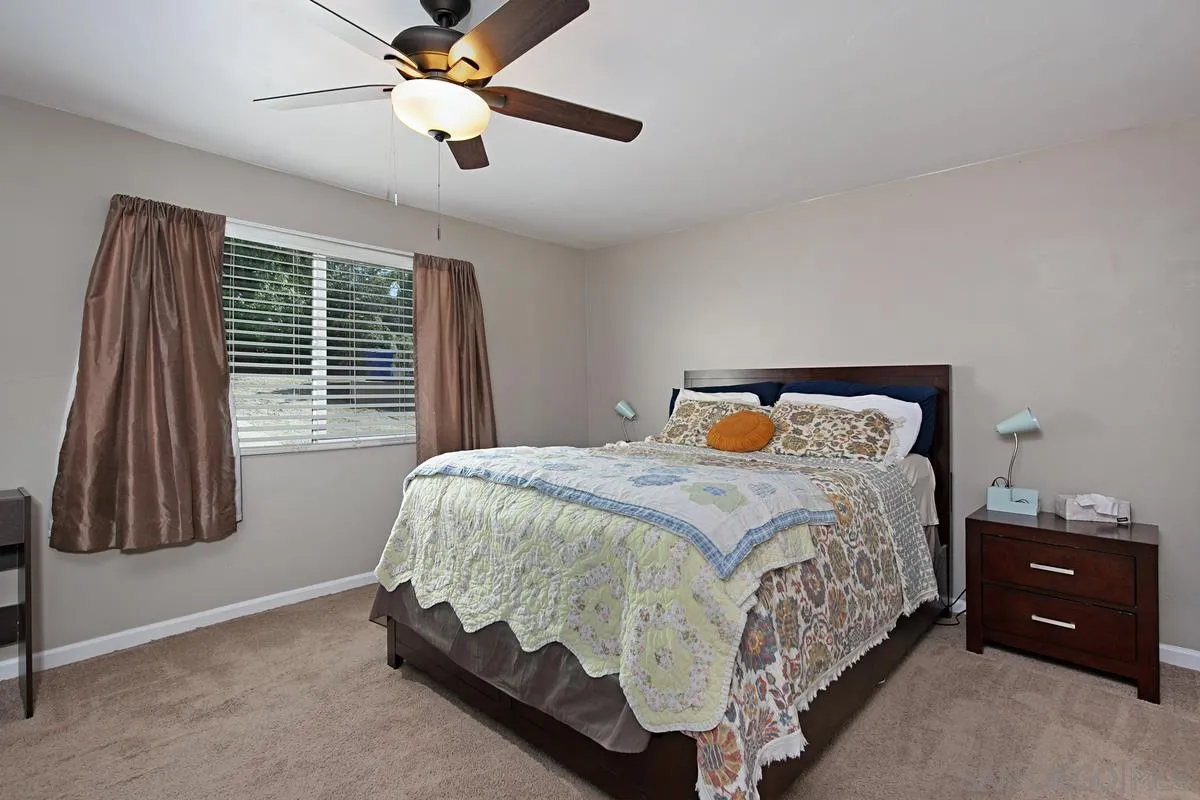 10390 Del Rio Road Spring Valley, CA 91978 - Photo 17 of 38 a bedroom with a bed and a window