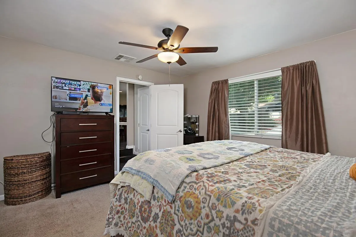 10390 Del Rio Road Spring Valley, CA 91978 - Photo 18 of 38 a bedroom with a bed and a closet
