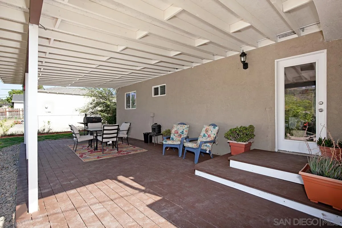 10390 Del Rio Road Spring Valley, CA 91978 - Photo 24 of 38 a view of a patio with table and chairs and potted plants