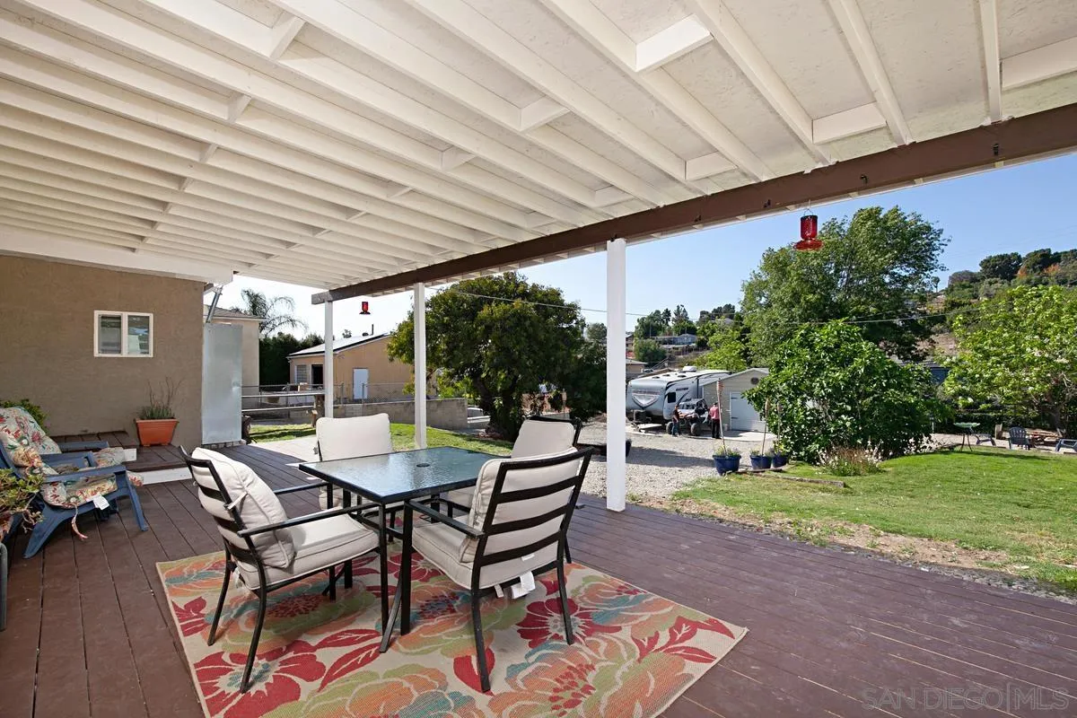 10390 Del Rio Road Spring Valley, CA 91978 - Photo 25 of 38 a view of a patio with a table and chairs under an umbrella