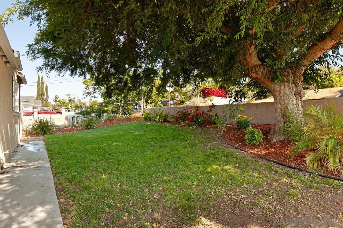 10390 Del Rio Road Spring Valley, CA 91978 - Photo 3 of 38 a backyard of a house with table and chairs