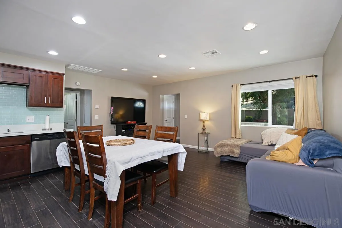 10390 Del Rio Road Spring Valley, CA 91978 - Photo 7 of 38 a view of a dining room with furniture window and wooden floor