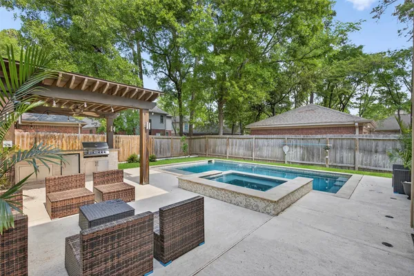 a view of patio with swimming pool