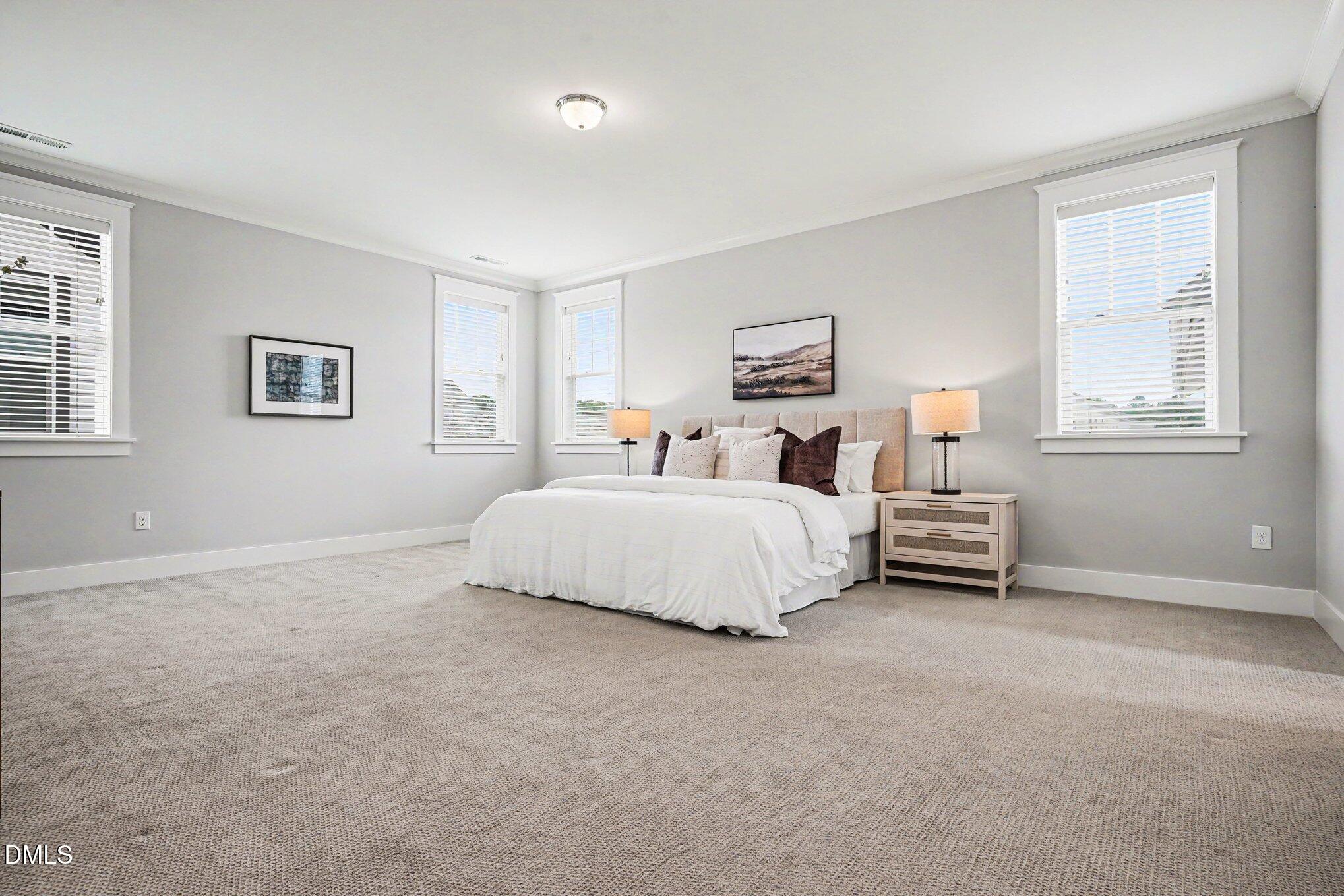 824 Watercolor Way Durham, NC 27713 - Photo 14 of 28 a bedroom with a bed and a window