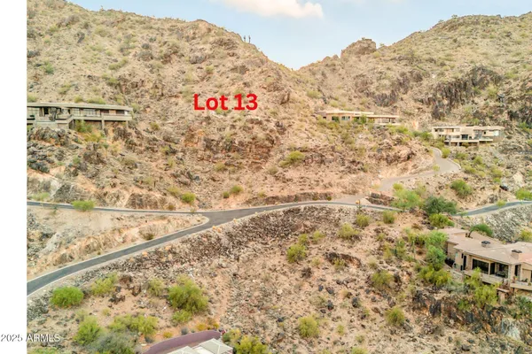 a signage on a wall next to a road