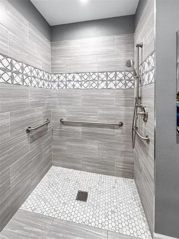 a view of a kitchen with kitchen island a sink wooden floor and a window
