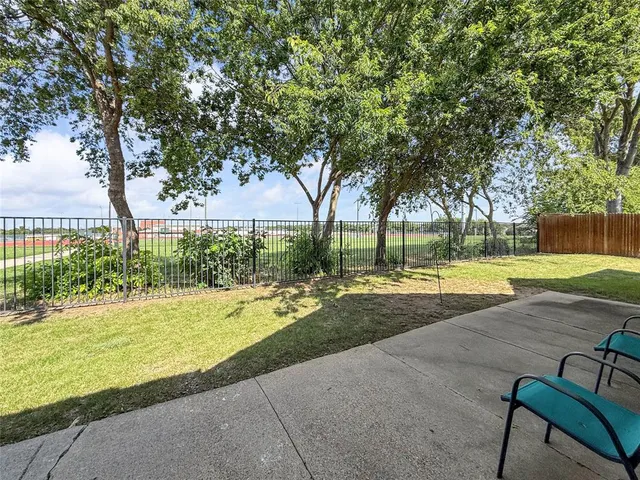 swimming pool with outdoor seating and yard