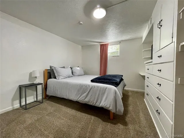 a bedroom with a bed and walk in closet