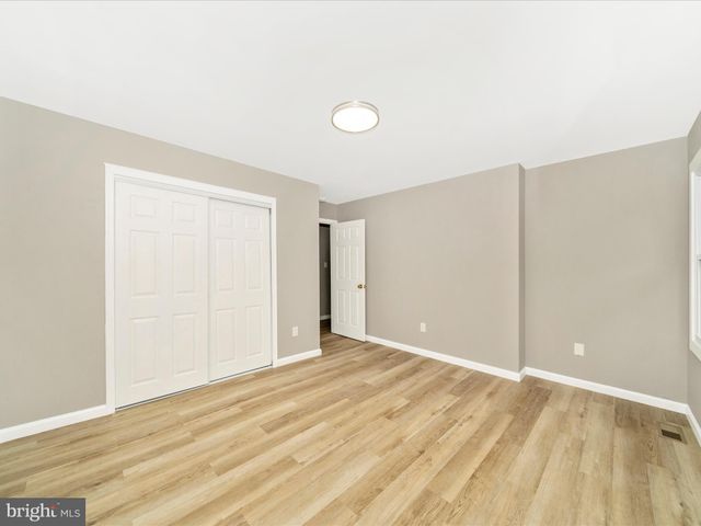 a bathroom with a bathtub shower sink vanity and a mirror
