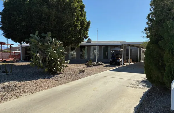 a view of house with outdoor space and porch