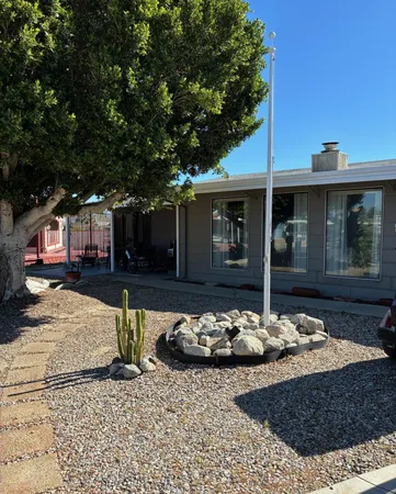 a front view of a house with garden