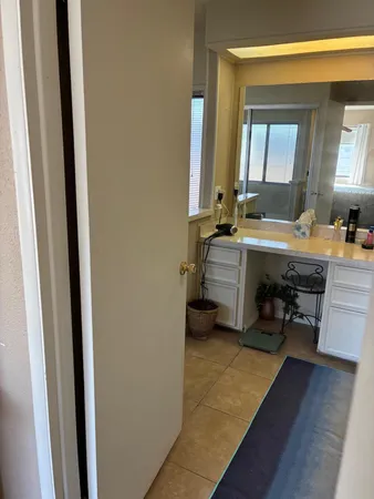 a view of walk in closet with window