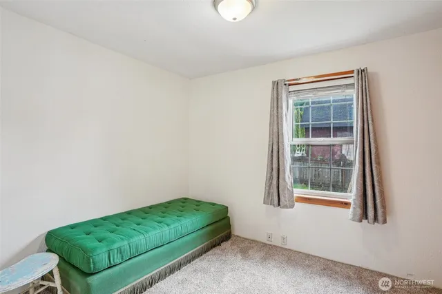 a room with a bed and a window