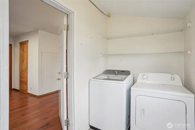 a view of storage and utility room with washer and dryer