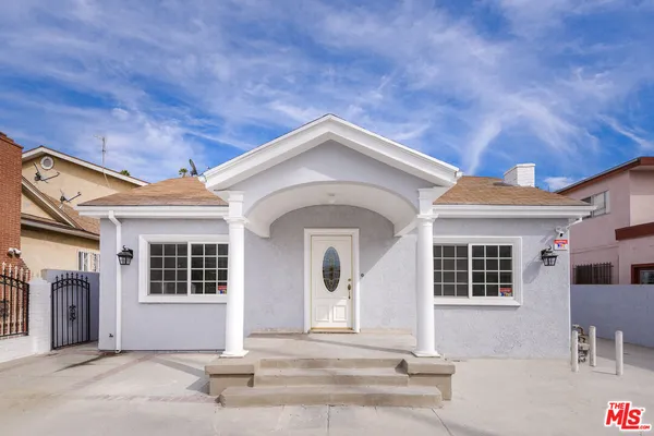 a front view of a house with a garage