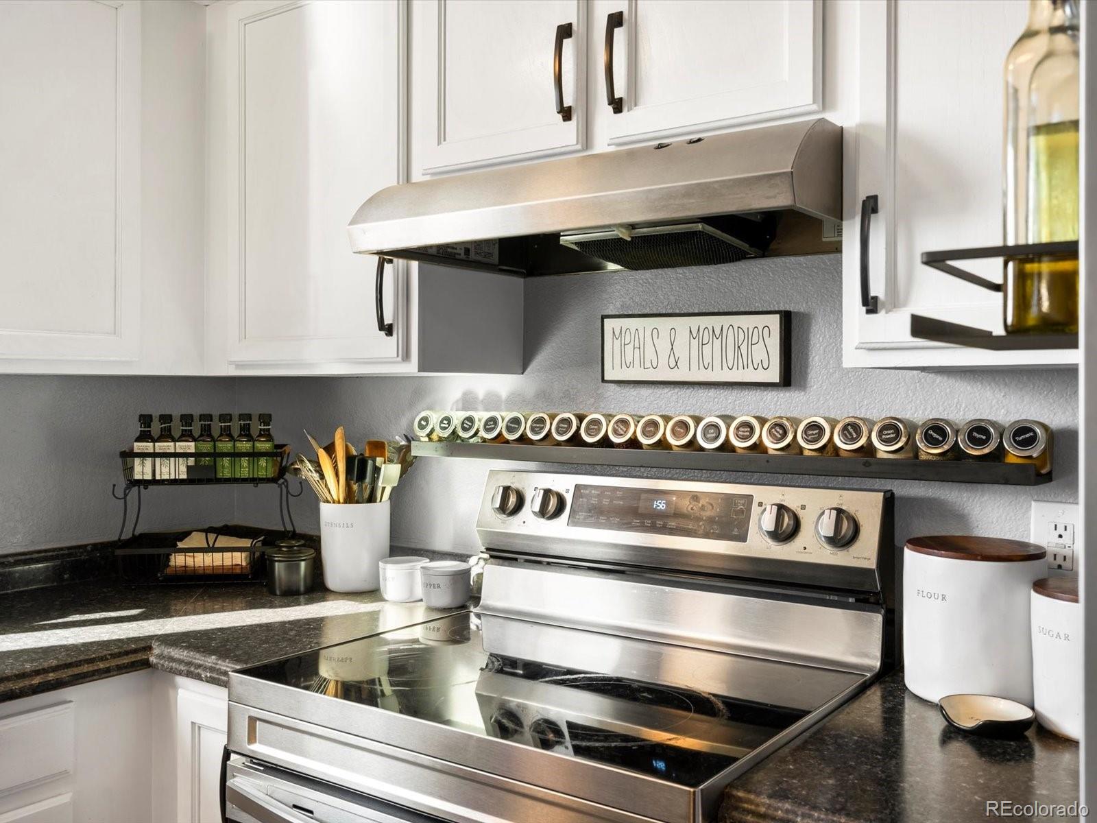 9657 Ironton Street Commerce City, CO 80022 - Photo 14 of 48 a close view of a stove and kitchen