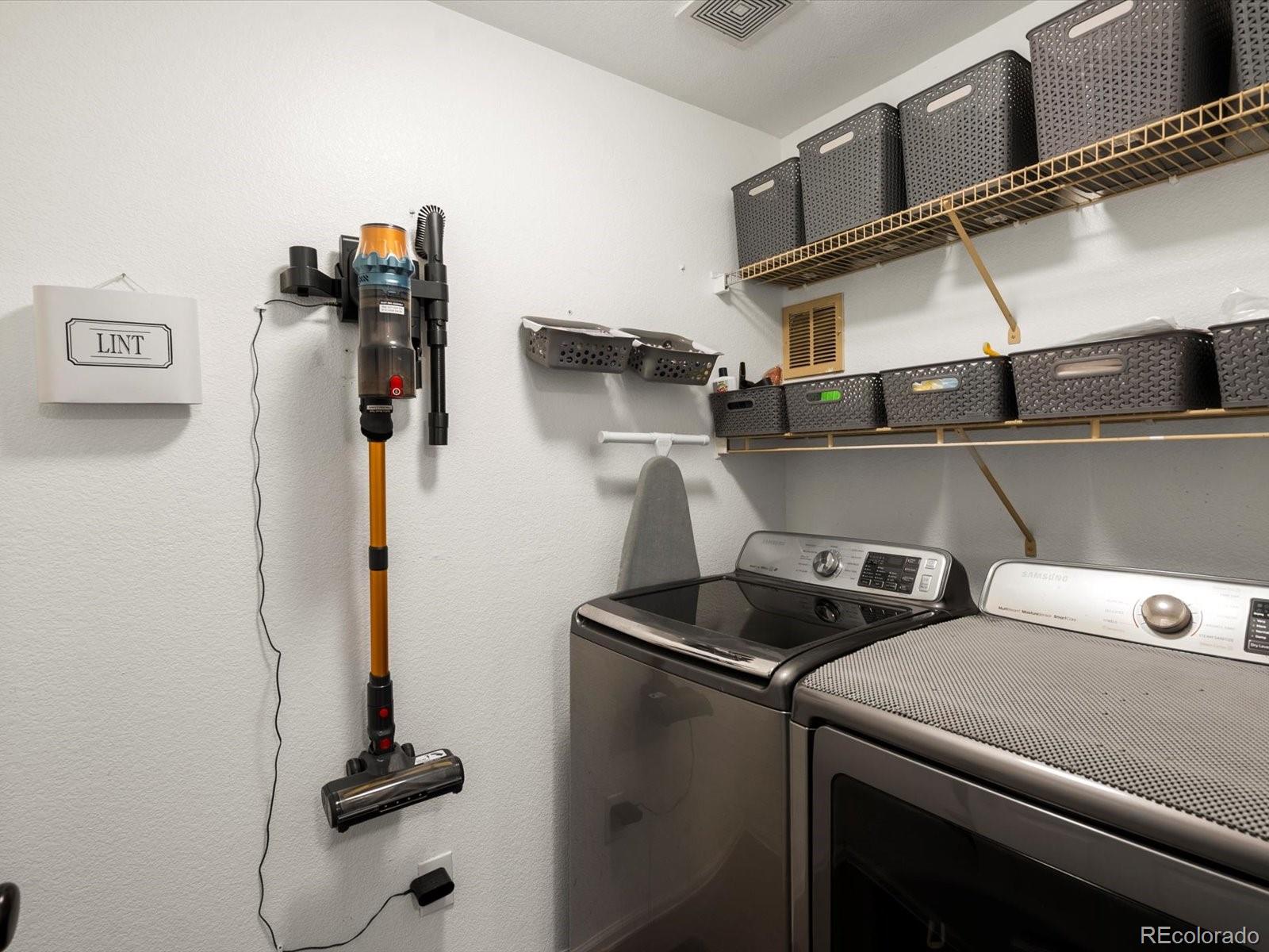 9657 Ironton Street Commerce City, CO 80022 - Photo 21 of 48 a utility room with dryer and washer