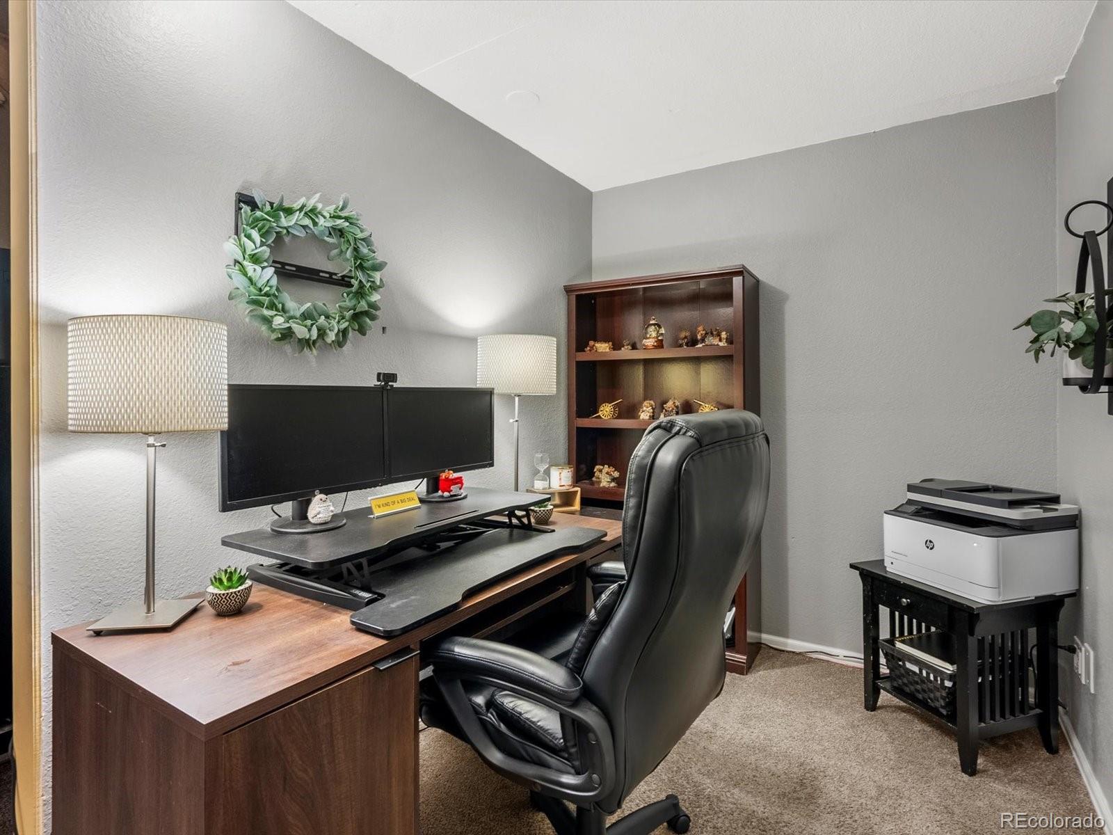 9657 Ironton Street Commerce City, CO 80022 - Photo 33 of 48 a room with furniture and a window