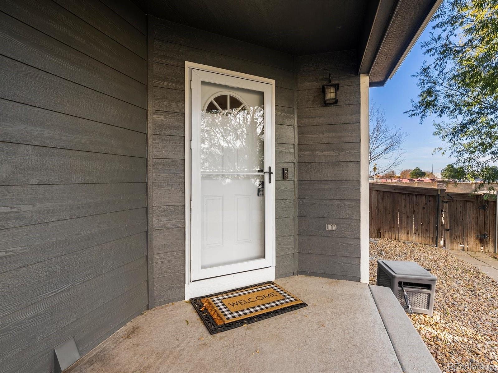 9657 Ironton Street Commerce City, CO 80022 - Photo 5 of 48 a backyard of a house with seating space