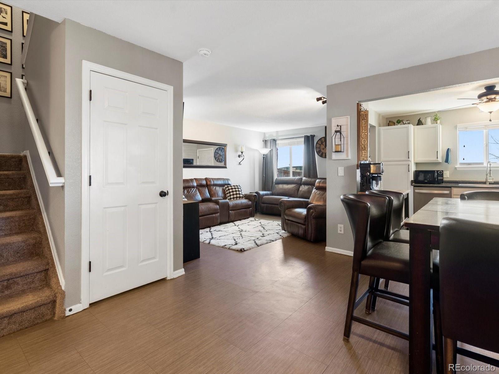 9657 Ironton Street Commerce City, CO 80022 - Photo 8 of 48 a living room with furniture and a large window