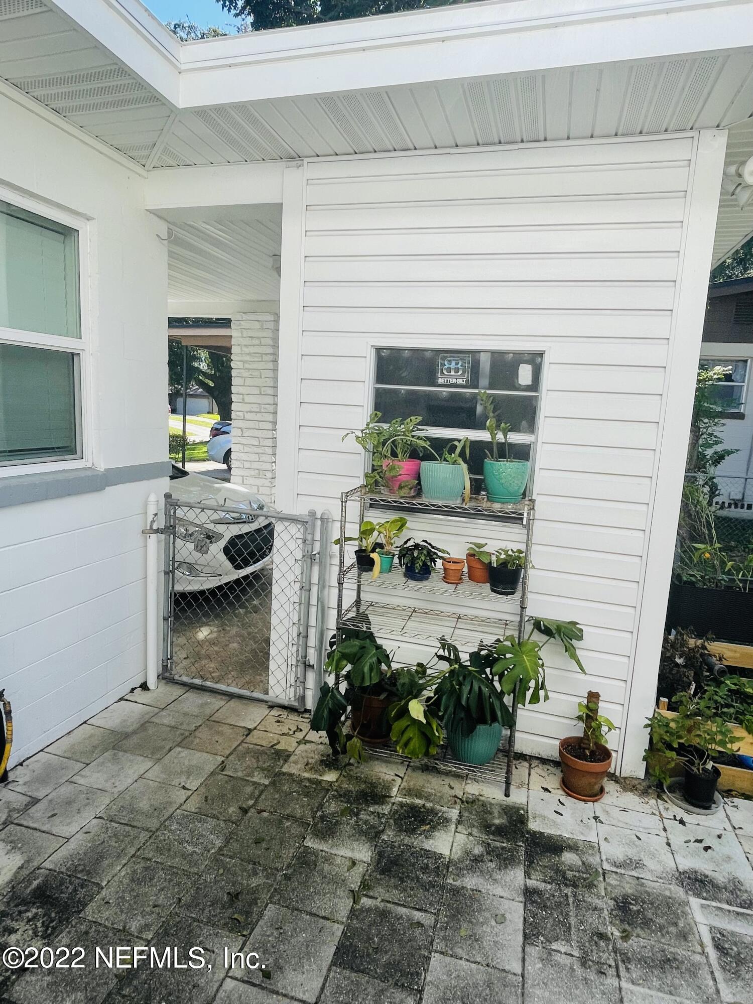 7009 Alana Road Jacksonville, FL 32211 - Photo 35 of 36 PATIO TO CARPORT AND LAUNDRY ROOM
