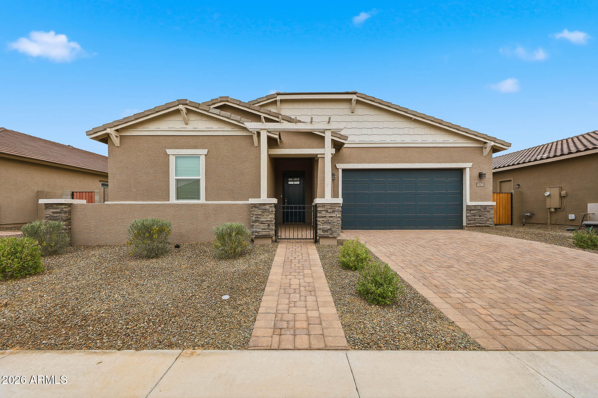 17633 West Pierson Street Goodyear, AZ 85395 - Photo 44 of 53 Front Front with pavered driveway.