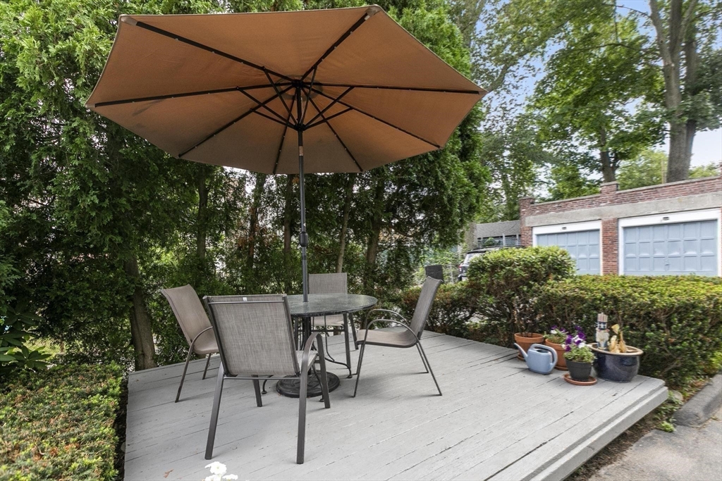 27 Dix Street, Unit 1 Boston, MA 02122 - Photo 8 of 10 a view of table and chairs under an umbrella