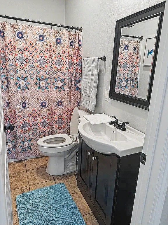 175 Ellen Lane Decaturville, TN 38329 - Photo 22 of 25 a bathroom with a toilet sink and mirror