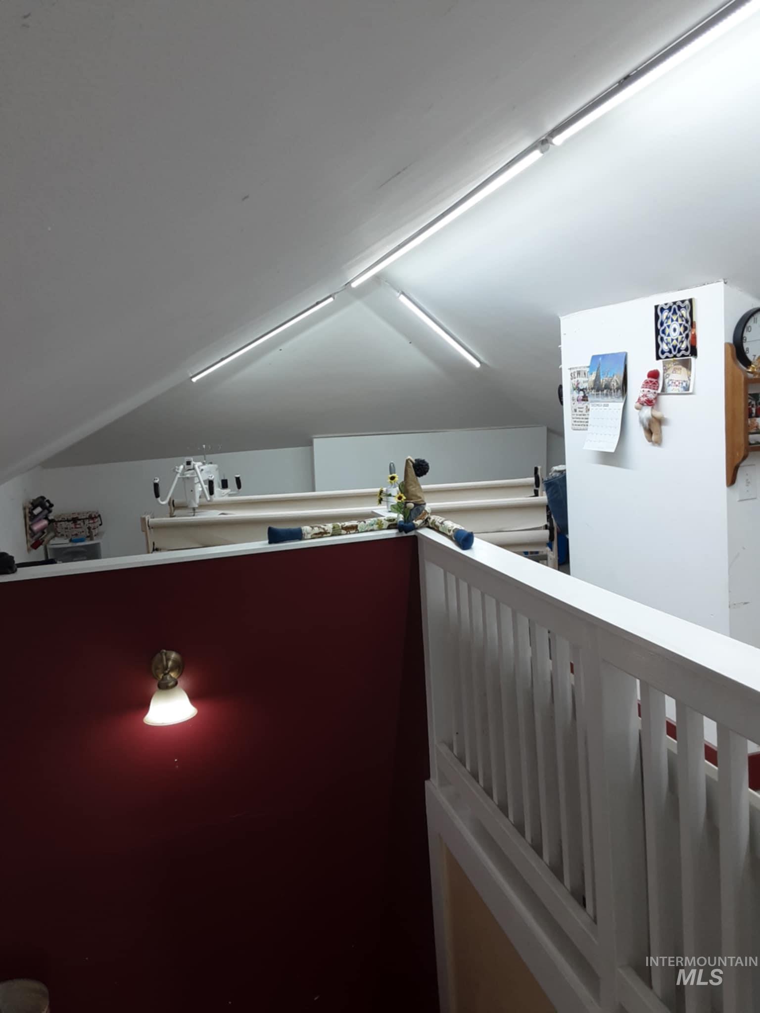 145 North Lincoln Avenue Oakley, ID 83346 - Photo 12 of 48 Hall with an upstairs landing and vaulted ceiling