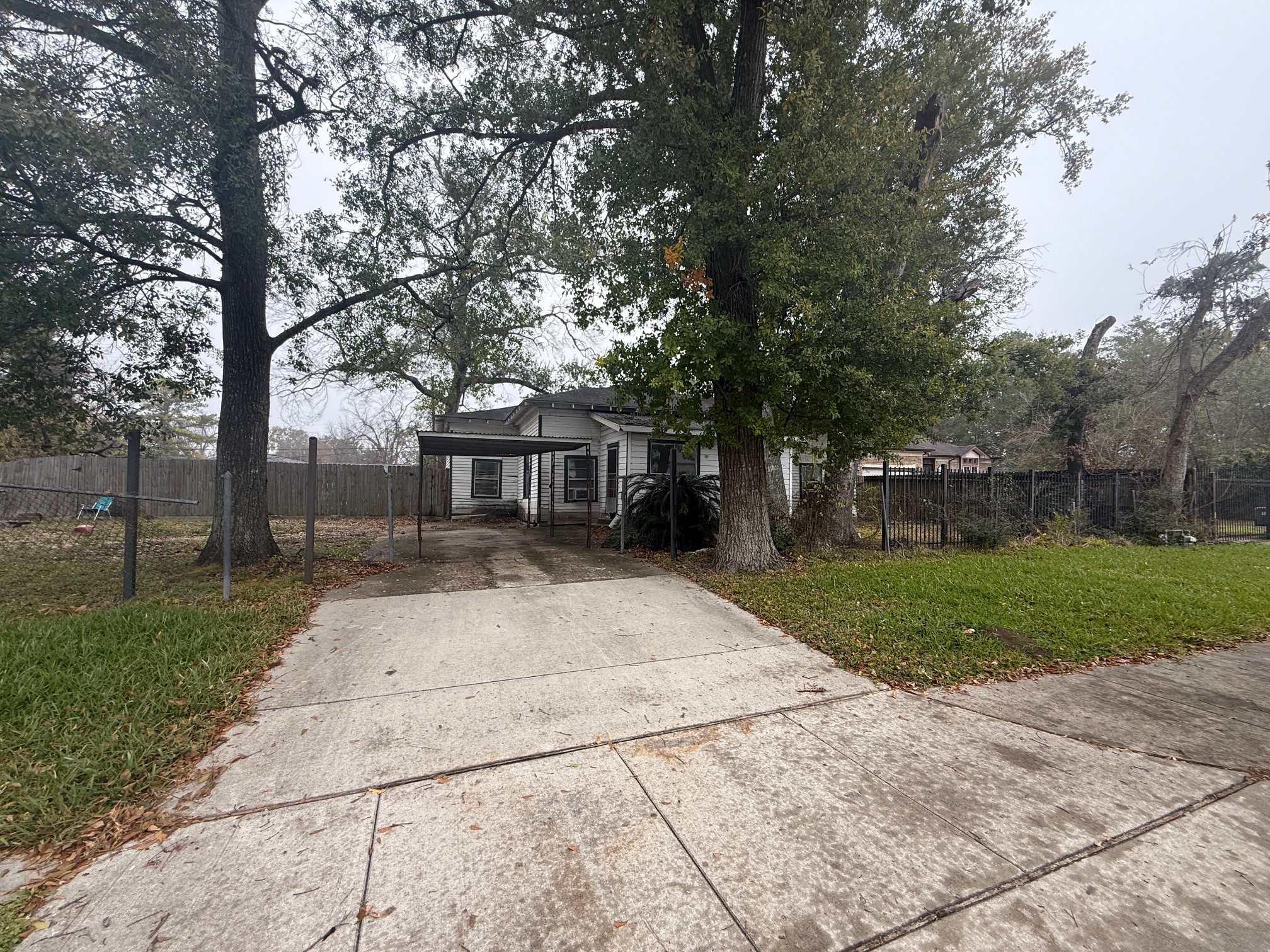 2630 Carmel Street Houston, TX 77091 - Photo 10 of 11 a front view of a house with a yard and a garden