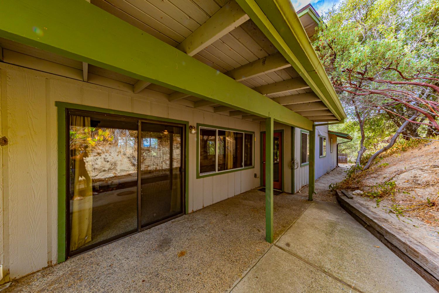42634 Springwood Road Oakhurst, CA 93644 - Photo 31 of 40 slider door is entrance to garage from side yard