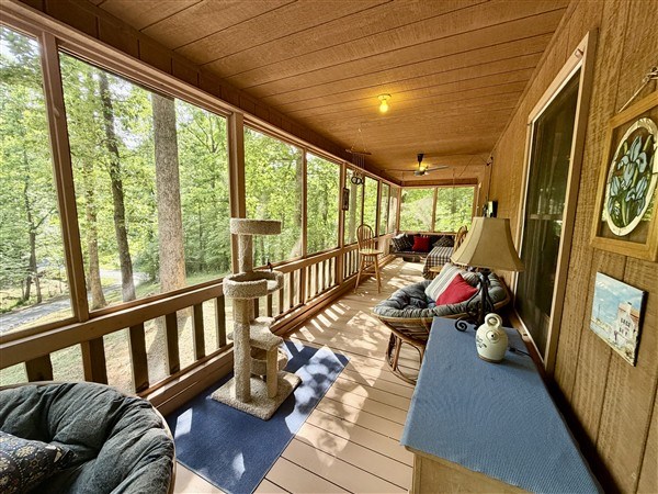 238 Trails End Road Blue Ridge, GA 30513 - Photo 24 of 32 a living room with furniture and a floor to ceiling window