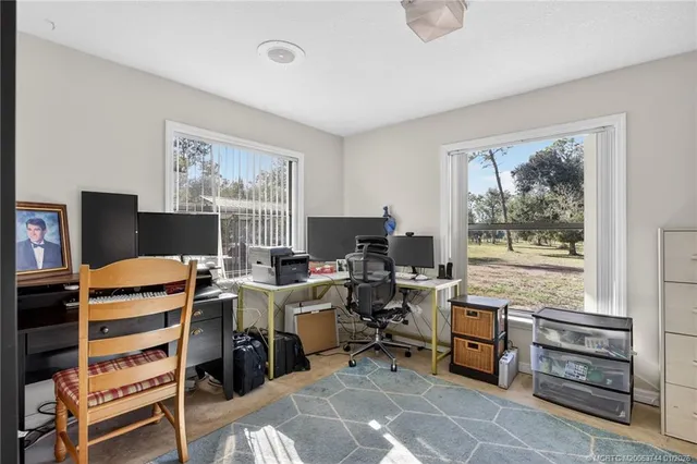 a view of a swimming pool with a patio and a yard