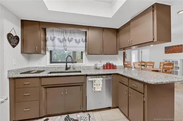 a view of backyard with wooden fence