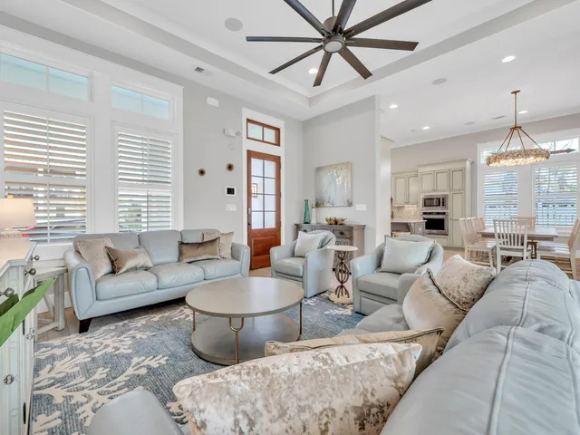 a kitchen with granite countertop white cabinets and stainless steel appliances