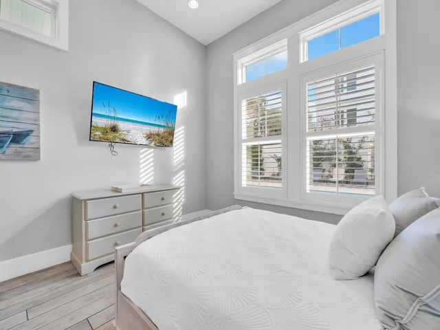 a bathroom with a granite countertop sink a toilet and a mirror