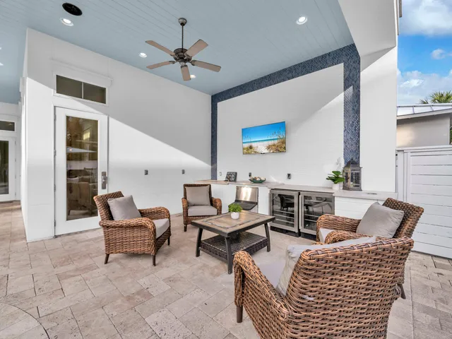 a view of a chairs and table in a balcony