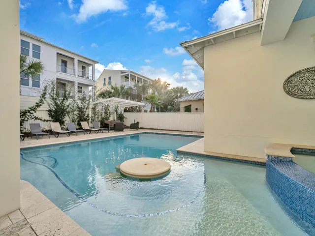 a spacious bedroom with a bed and glass window