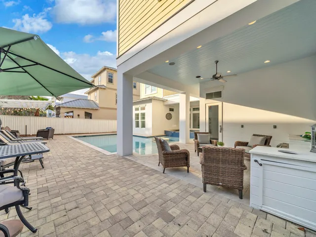 a bathroom with a granite countertop sink toilet a mirror and shower