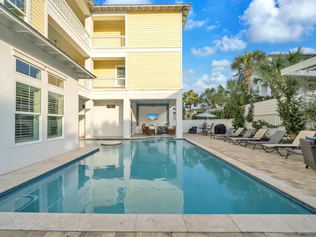 a bathroom with a granite countertop sink toilet a mirror and shower
