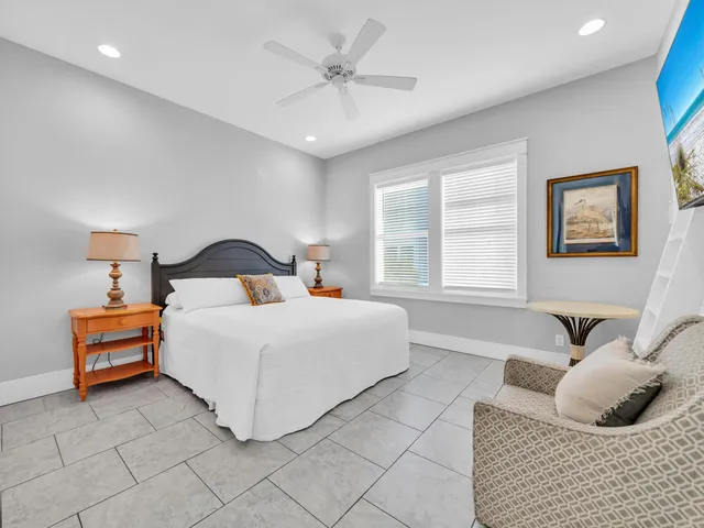 a spacious bedroom with a bed and a walk in closet