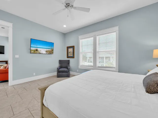 a bathroom with a granite countertop sink a toilet and a mirror
