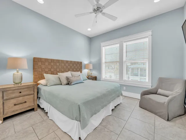 a spacious bedroom with a bed and a table